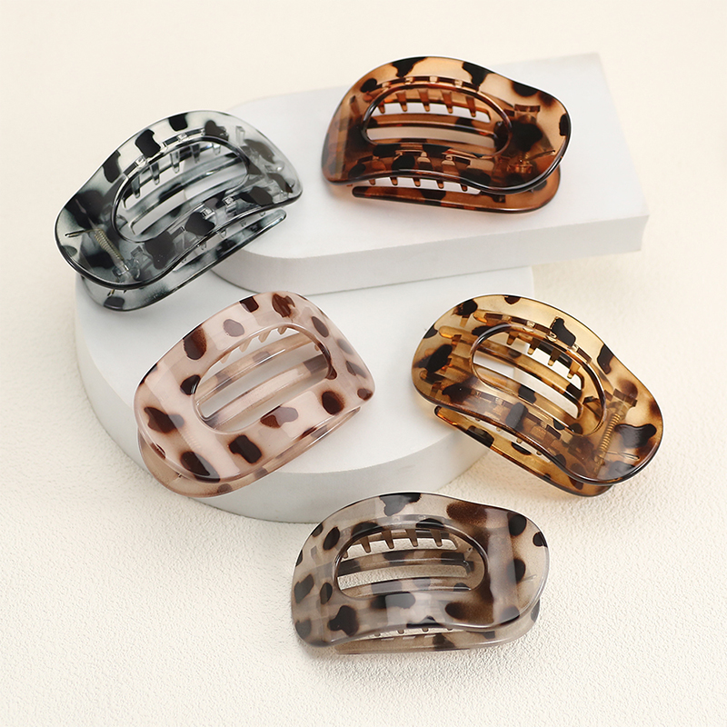 Injected plastic hair claw clip in the shape of a duckbill