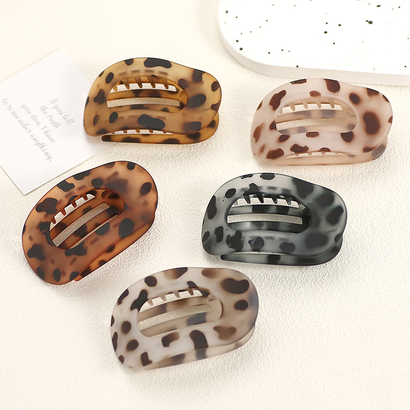 Injected plastic hair claw clip in the shape of a duckbill