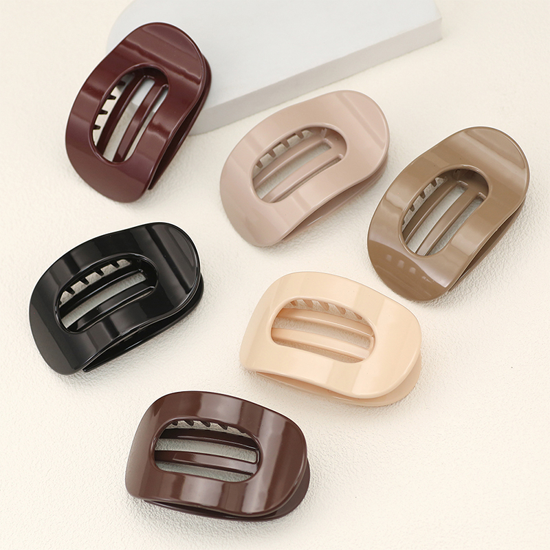 Injected plastic hair claw clip in the shape of a duckbill