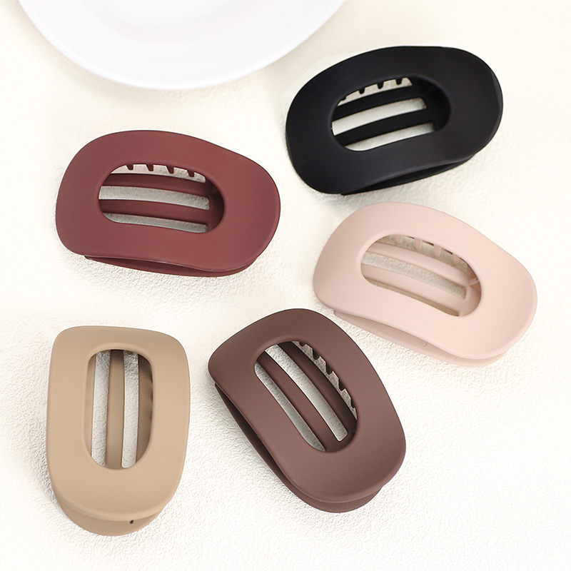 Injected plastic hair claw clip in the shape of a duckbill