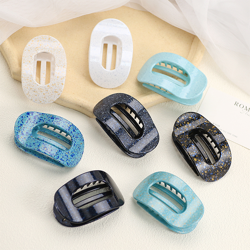 Injected plastic hair claw clip in the shape of a duckbill
