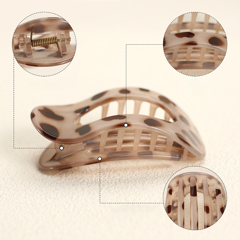 Injected plastic hair claw clip in the shape of a duckbill